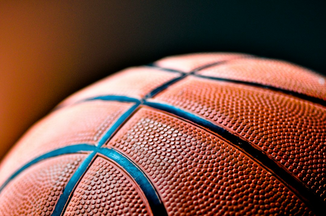 brown and black basketball ball